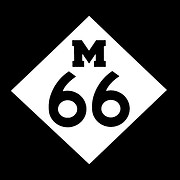 M-66 Groceries and Barns logo